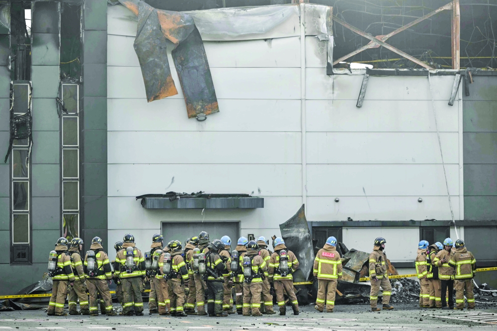 Firefighters gather at the site of a fire at a lithium battery factory owned by South Korean battery maker Aricell in Hwaseong. — AFP 