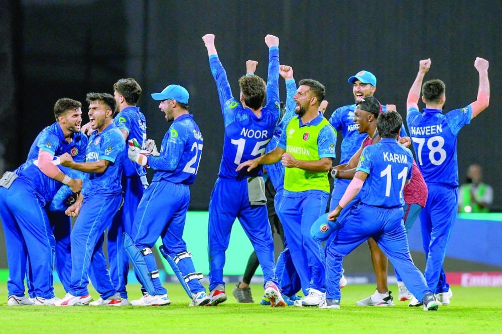 Afghanistan's players celebrate the winning. — AFP