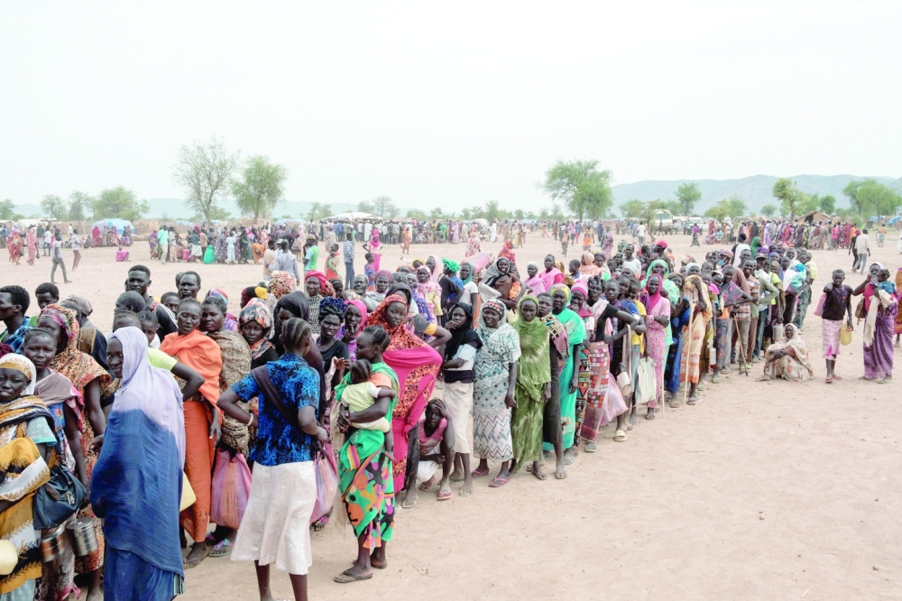 People line up to register for a potential food aid delivery at a camp for internally displaced persons (IDP) in Agari, North Kordofan. — AFP 