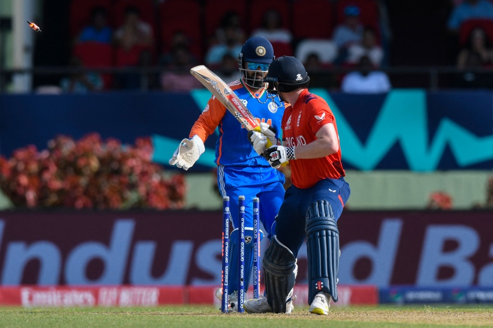 Kuldeep Yadav of India celebrates the dismissal of Harry Brook of England during the ICC men's Twenty20 World Cup 2024 semi-final cricket match 