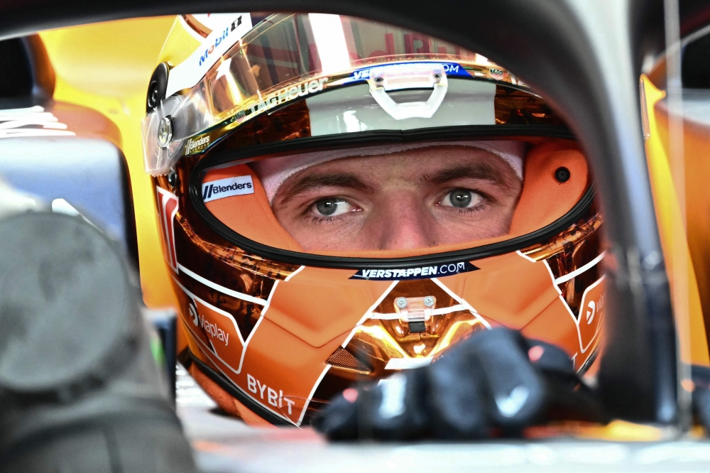 Red Bull's Dutch driver Max Verstappen sits in his car in the pits prior to the first practice session on the Red Bull Ring race track in Spielberg