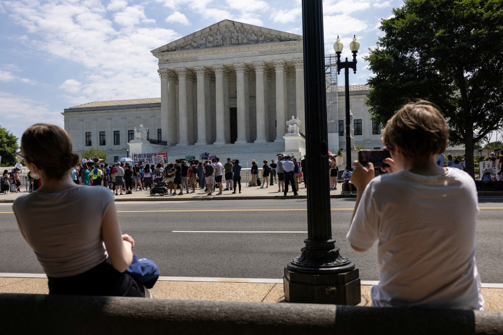 Demonstrators gather outside the US Supreme Court