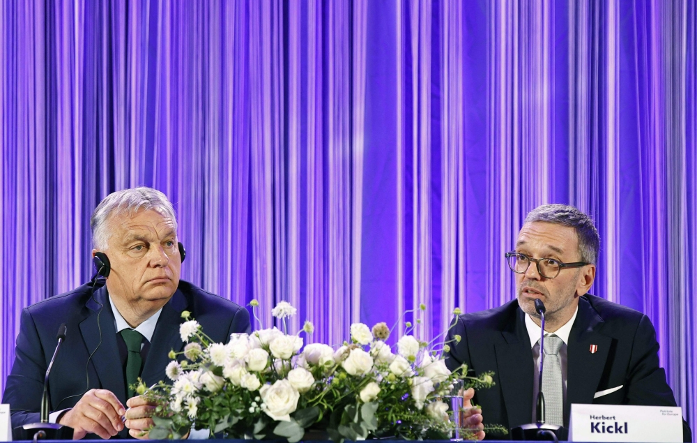 Hungary's PM Viktor Orban (L) attends a meeting with Chairman of the Freedom Party Austria (FPOe) Herbert Kickl for a joint statement, in Wien. — AFP 