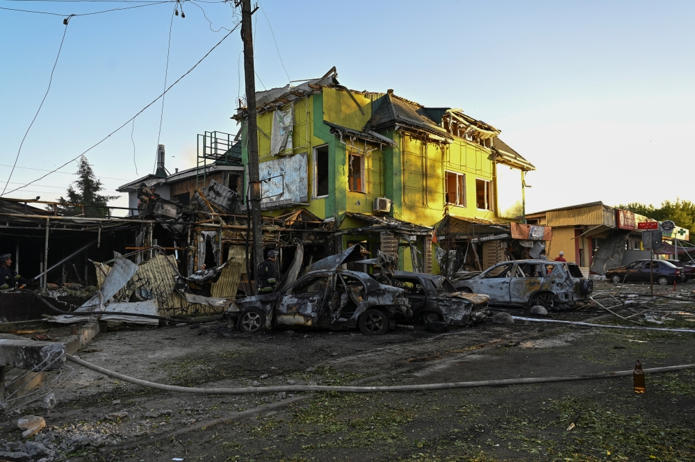 Firefighters work at a site of a Russian missile strike, in the town of Vilniansk, Zaporizhzhia region. — Reuters 