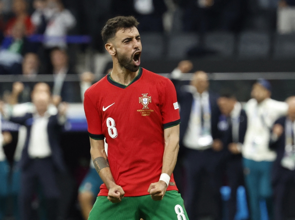 Portugal's Bruno Fernandes celebrates scoring a penalty during the penalty shootout. — REUTERS