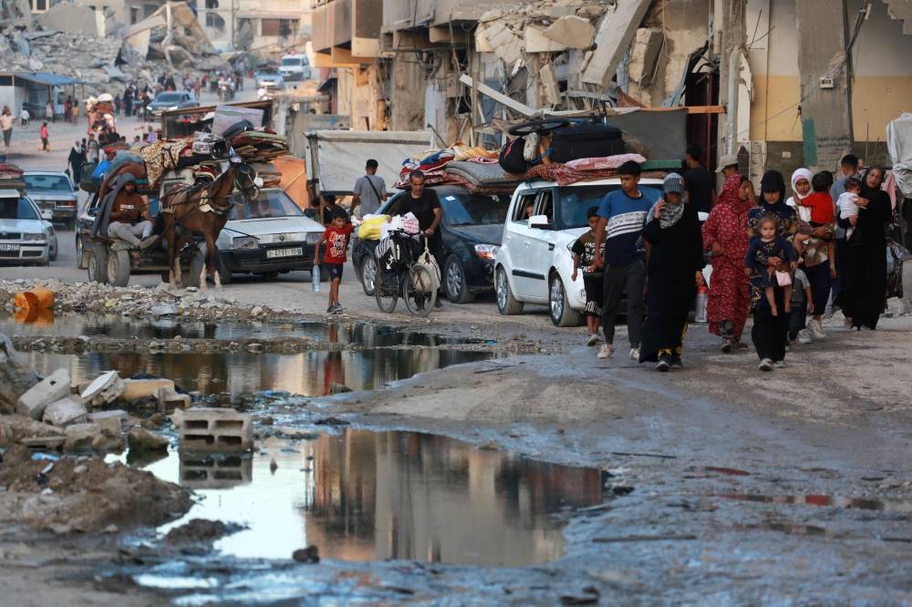 Palestinians flee the evacuation area in east Khan Yunis. — AFP 