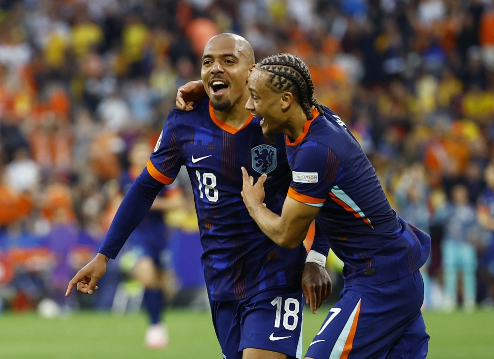 Soccer Football - Euro 2024 - Round of 16 - Romania v Netherlands - Munich Football Arena, Munich, Germany - July 2, 2024 Netherlands' Donyell Malen celebrates scoring their third goal with Xavi Simons REUTERS/Michaela Stache
