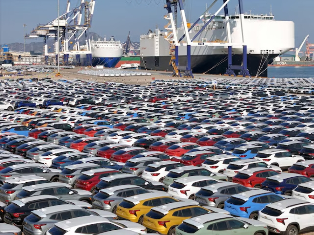 Cars to be exported sit at a terminal in the port of Yantai, Shandong province, China.  — Reuters