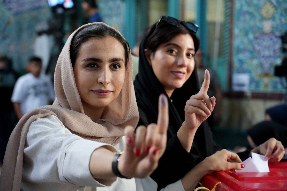 Iranian women after casting their ballots at a polling station in Tehran