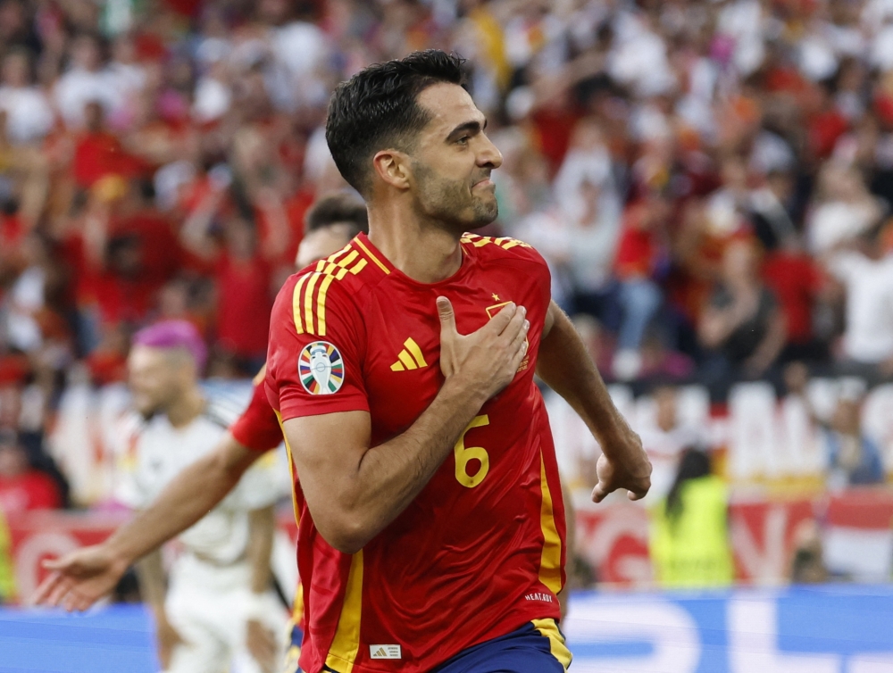 Spain's Mikel Merino celebrates scoring their second goal
