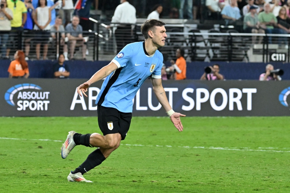  Manuel Ugarte celebrates after scoring in a penalty shoot-out.— AFP 

