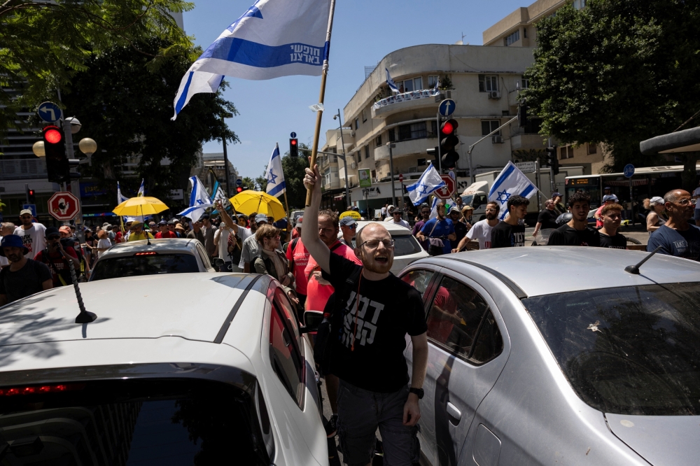 Protesters march along Dizengoff Street to demand the release of captives held in Gaza. — Reuters 