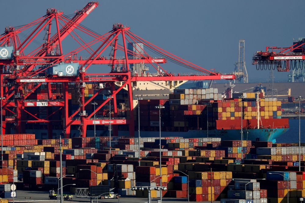 Ships and shipping containers are pictured at the port of Long Beach in Long Beach, California, US. — Reuters