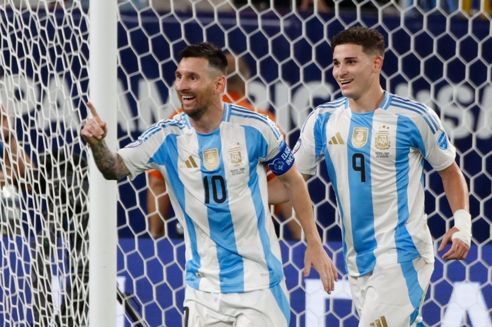 Lionel Messi celebrates scoring second goal. — AFP


