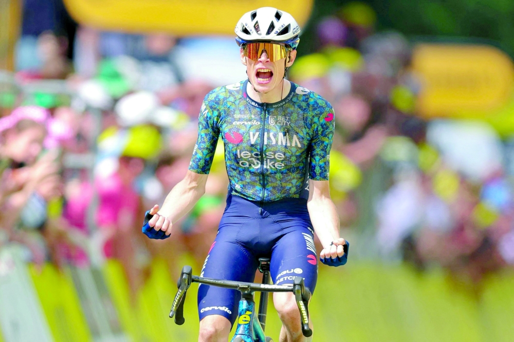 Jonas Vingegaard cycles to the finish line  