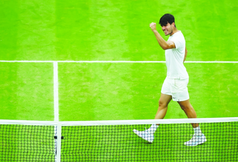 Spain's Carlos Alcaraz celebrates the winning. — Reuters