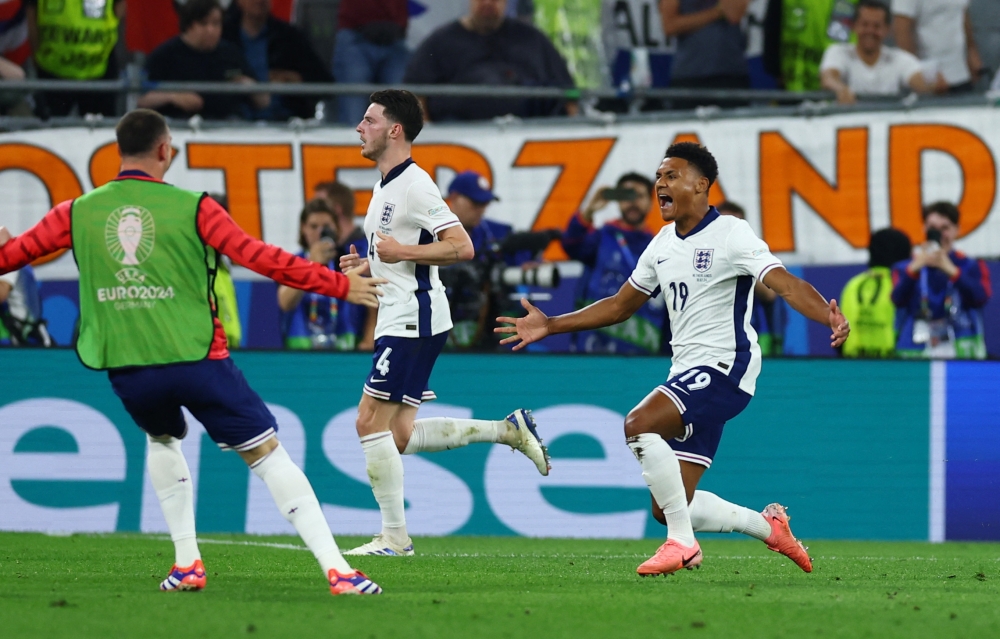 England's Ollie Watkins celebrates scoring their second goal. — Reuters
