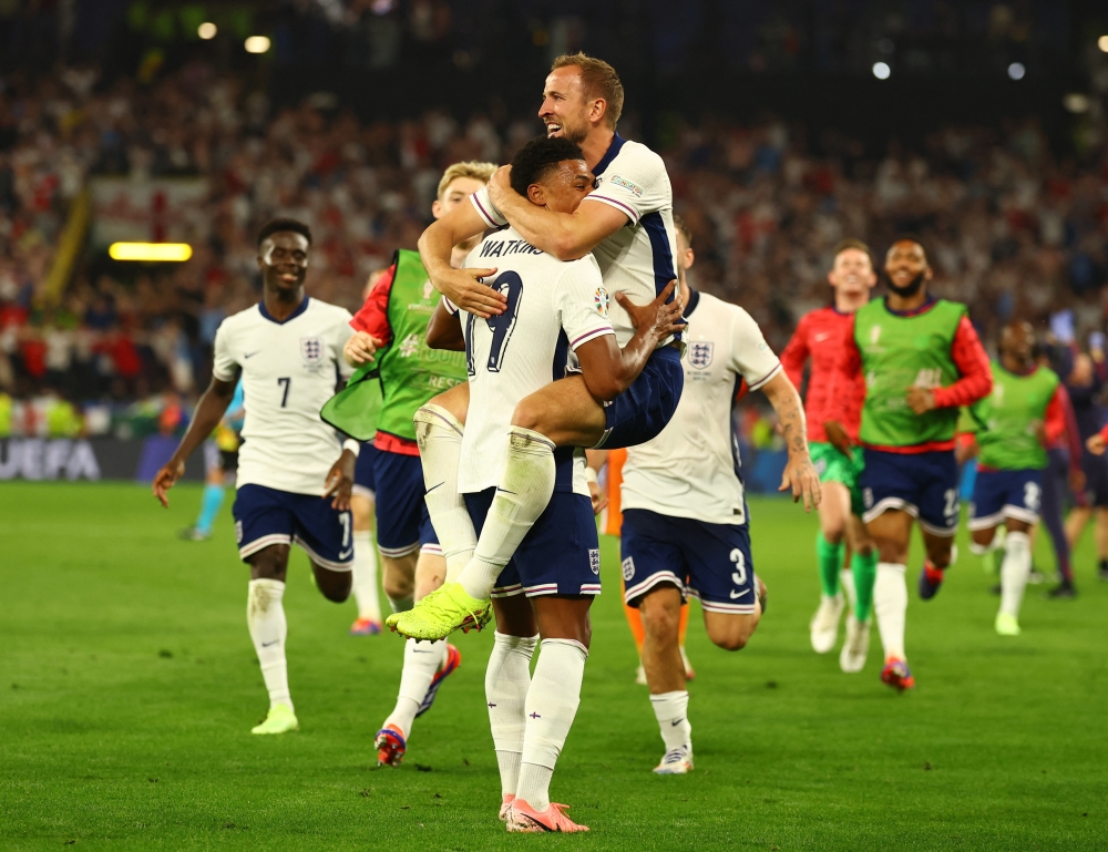 England's Harry Kane celebrates with Ollie Watkins after the winning. — Reuters
