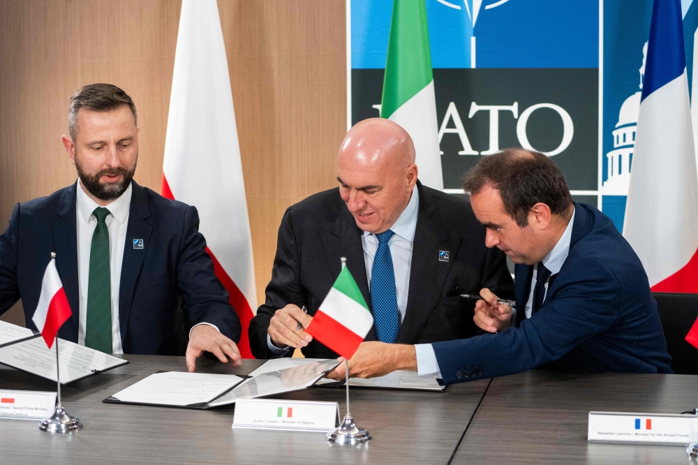 Defence ministers of Poland, Wladyslaw Kosiniak-Kamysz; of Italy, Guido Crosetto; and of France, Sebastian Lecornu, sign a Letter of Intent on a 'European Long-Range Strike Approach,' or ELSA which  aims at improving the ability, as Europeans, to develop, produce, and deliver capabilities in the area of long-range strike, on the sidelines of the Nato 75th anniversary summit in Washington, DC. - AFP

