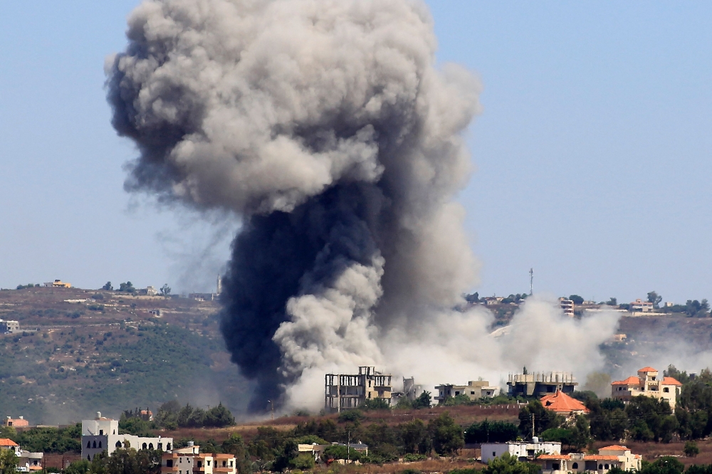 Smoke billows from the site of an Israeli airstrike in the southern Lebanese village of Jibbain. - AFP
