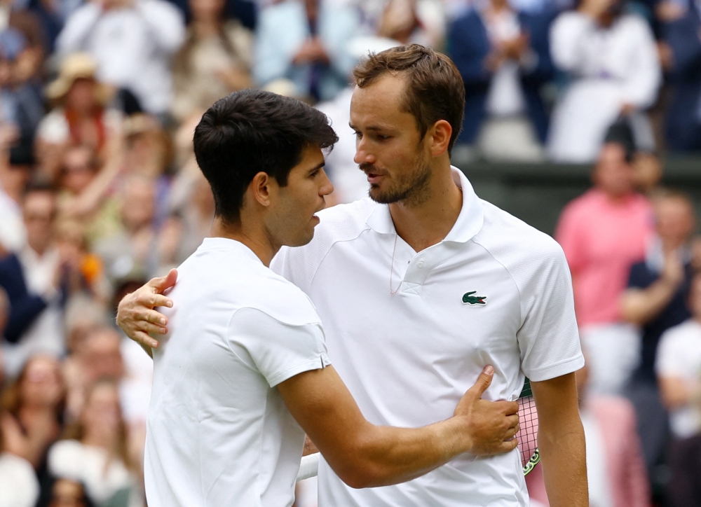 Spain's Carlos Alcaraz consoles Russia's Daniil Medvedev after winning their semi final match