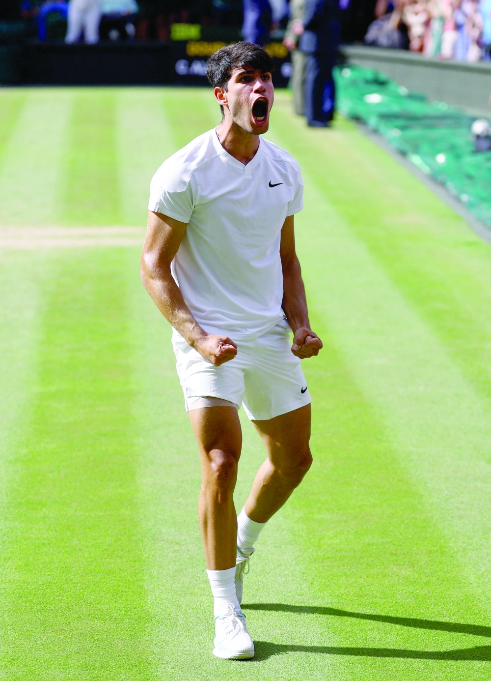 Carlos Alcaraz celebrates the winning.— Reuters