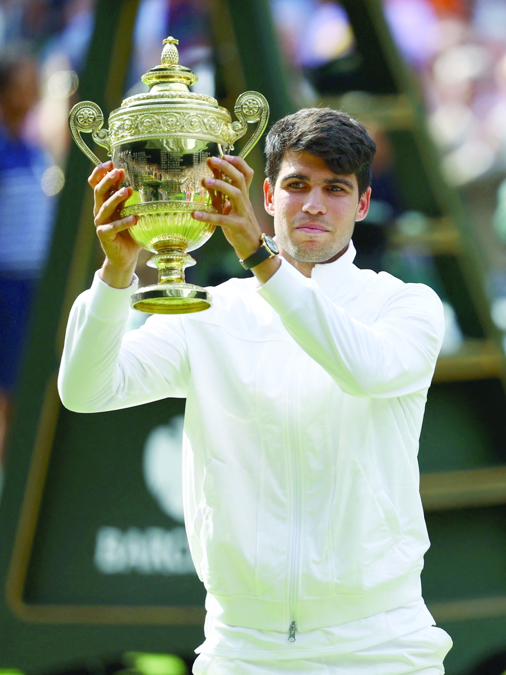 Carlos Alcaraz celebrates with the trophy. — Reuters