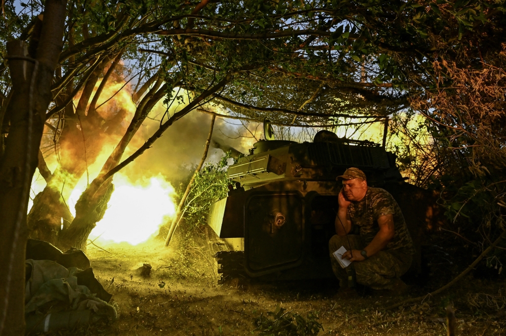 A Ukrainian artillerist fires a 2S1 Gvozdika self-propelled howitzer towards Russian troops, in Donetsk region. — Reuters 