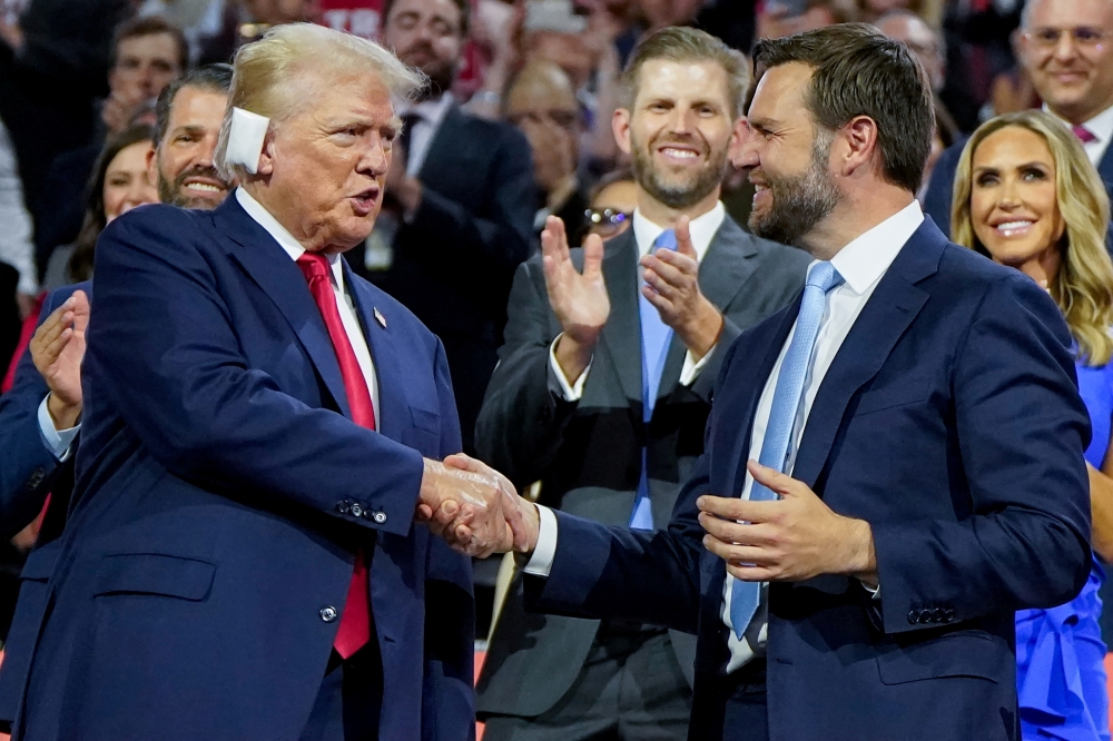 Republican presidential nominee and former U.S. President Donald Trump and Republican vice presidential nominee J.D. Vance shake hands, at the Fiserv Forum in Milwaukee. — Reuters 