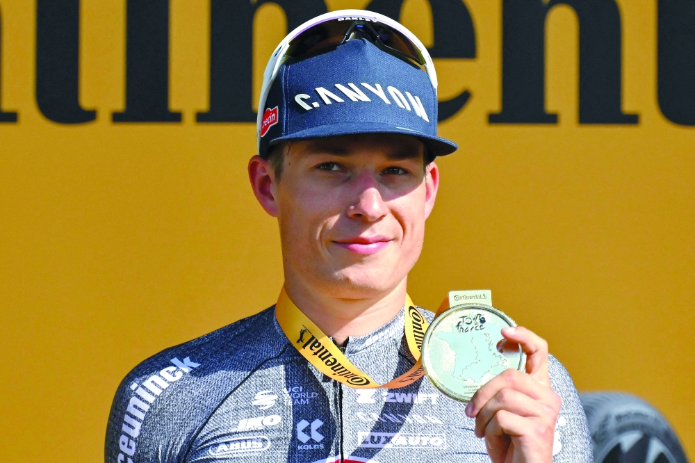  Jasper Philipsen celebrates on the podium. — AFP