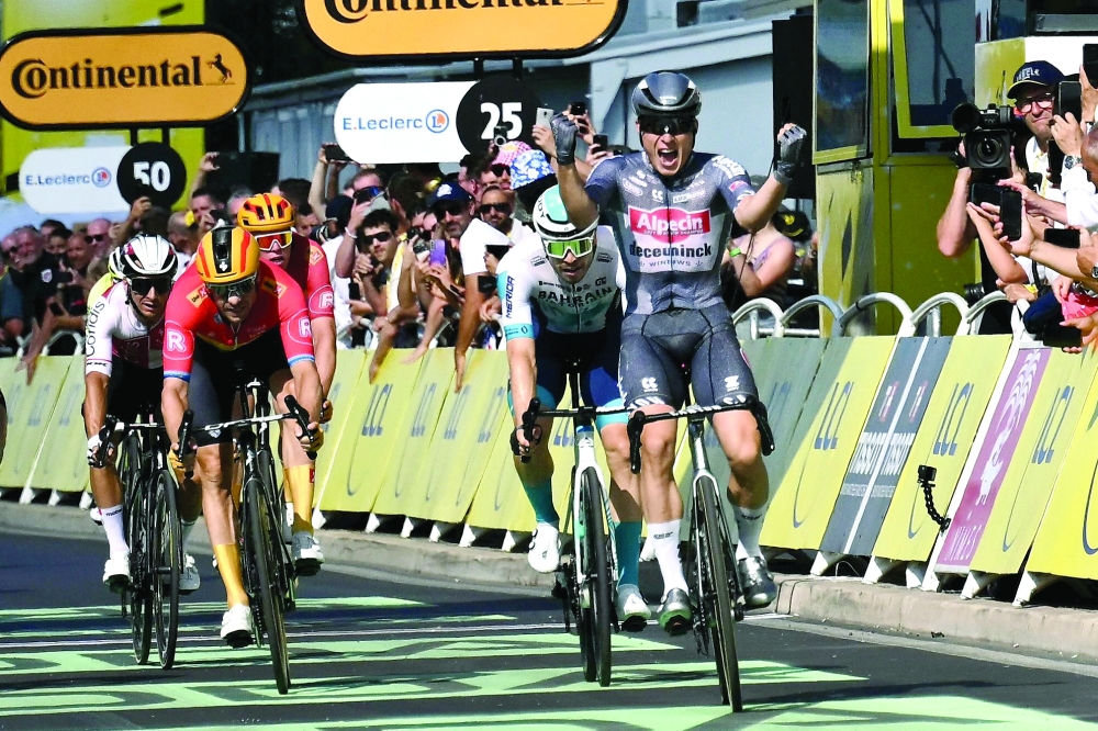 Jasper Philipsen cycles to the finish line. — AFP