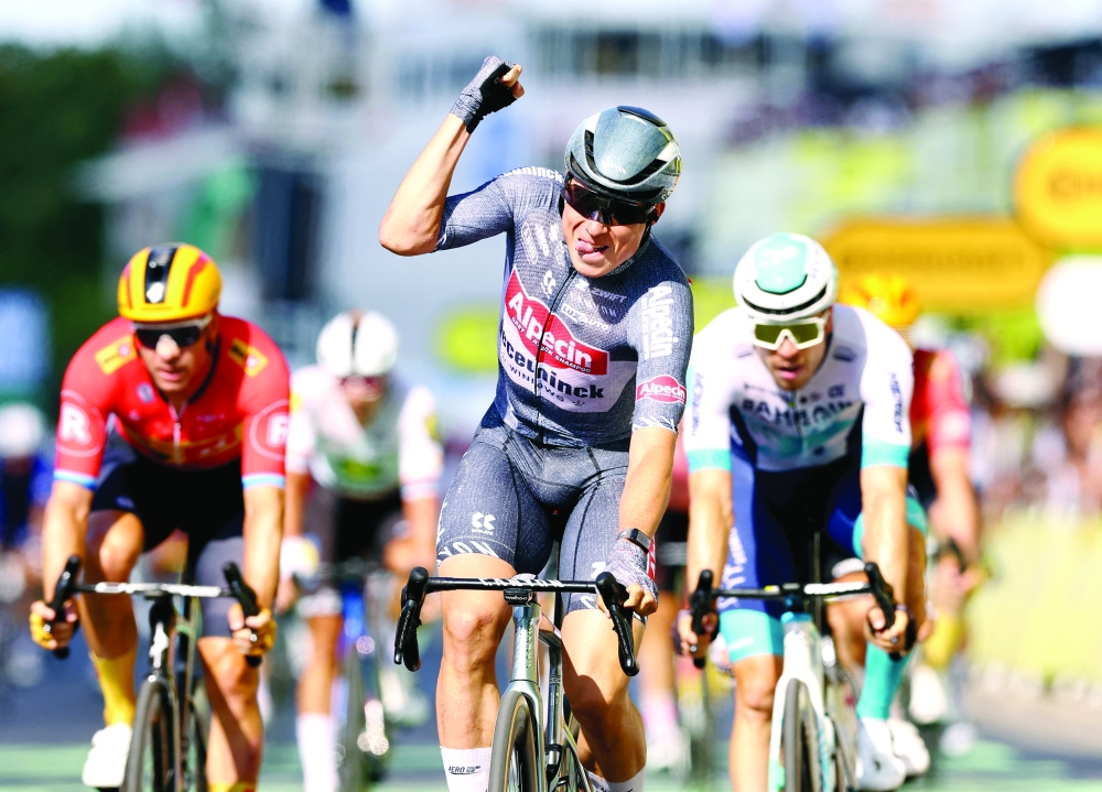 Jasper Philipsen cycles to the finish line. — Reuters
