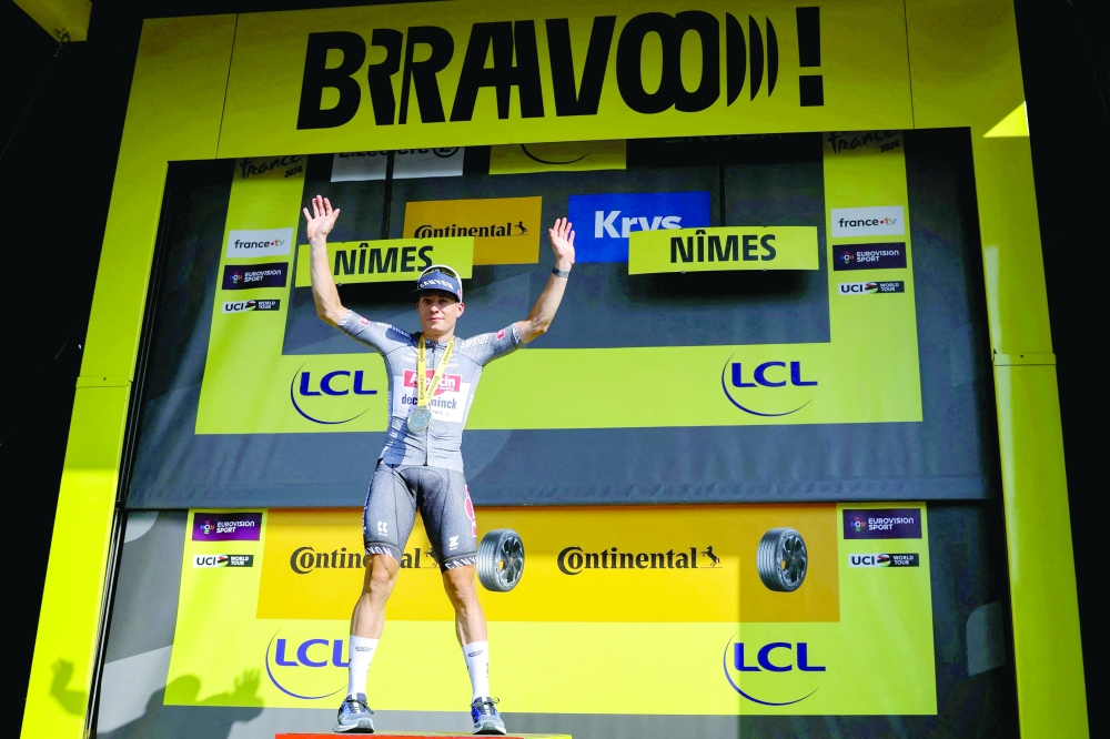  Jasper Philipsen celebrates on the podium. — AFP