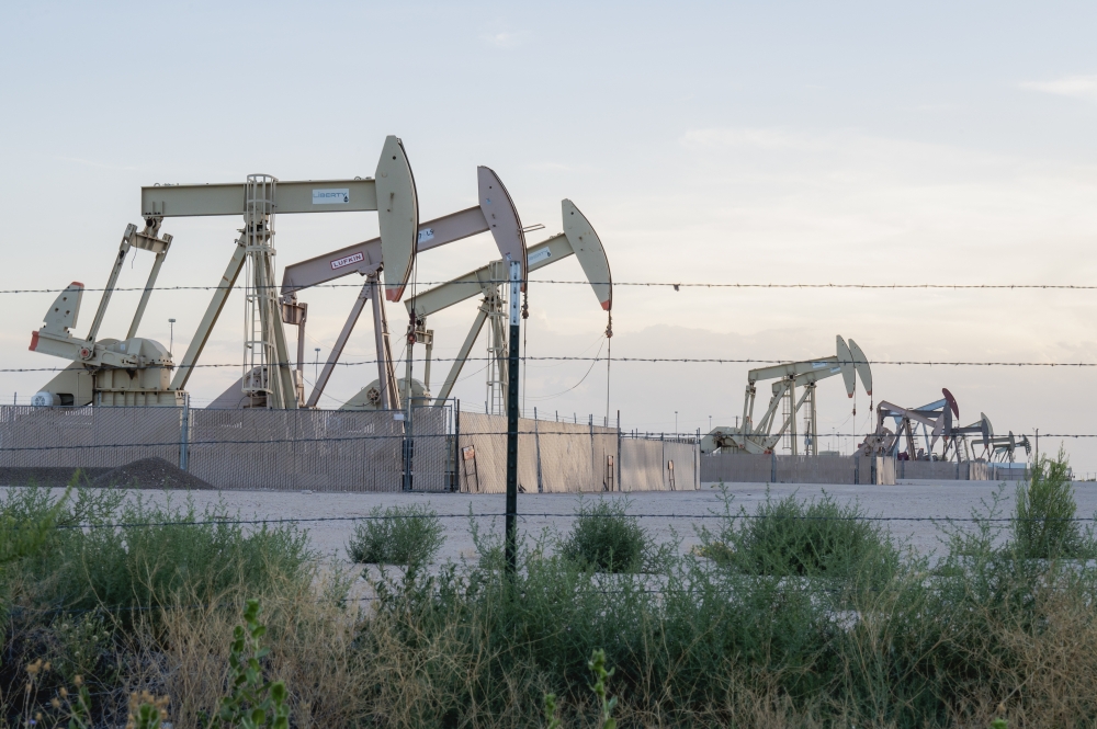 Pump jacks extracting crude oil outside of Midland, Texas, July 3, 2024.  (Desiree Rios/The New York Times) 