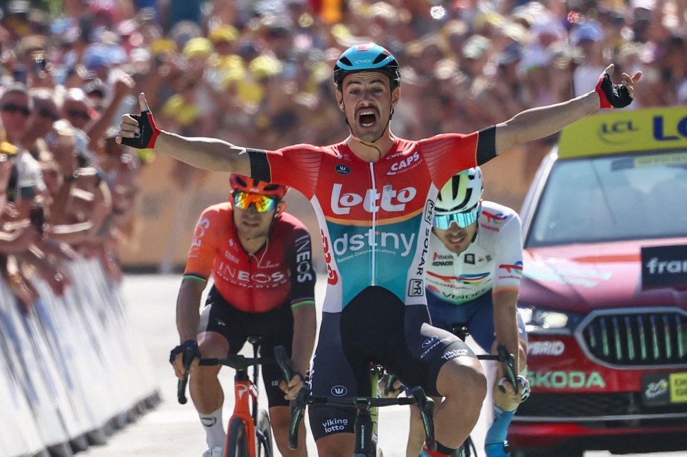Victor Campenaerts cycles to the finish line to win the 18th stage of the the Tour de France on Thursday. — AFP