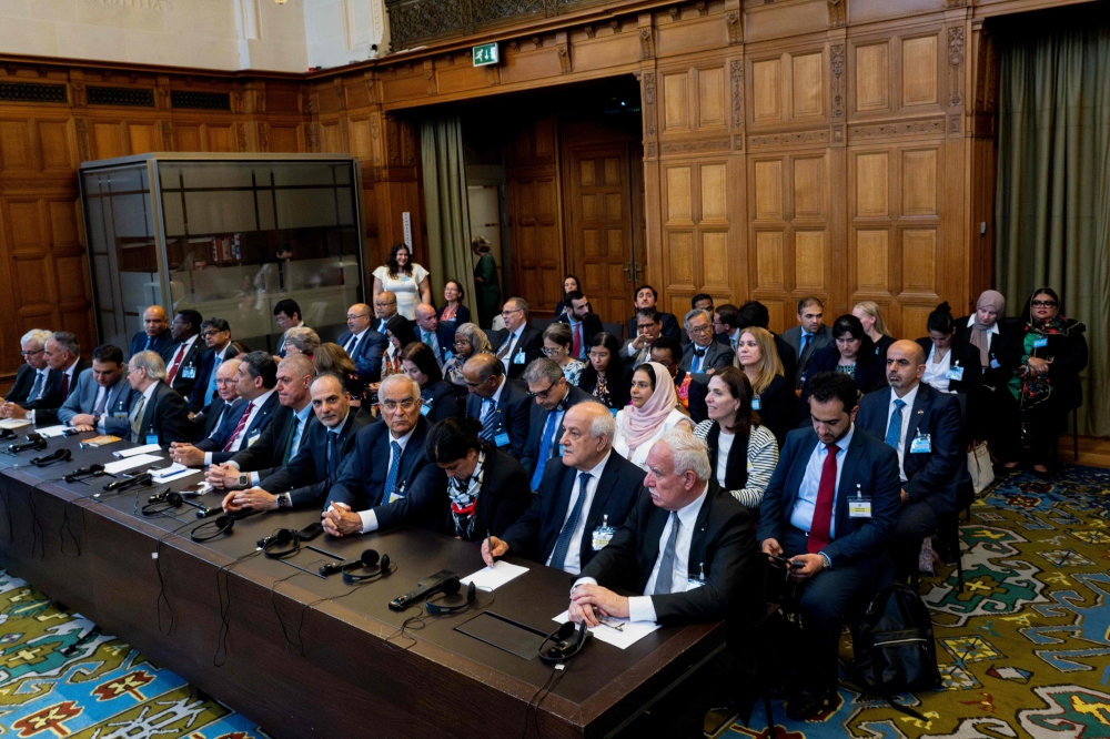 Officials of the Palestinian delegation attend a non-binding ruling on the legal consequences of the Israeli occupation of the West Bank and East Jerusalem at the International Court of Justice (ICJ) in The Hague. - AFP
