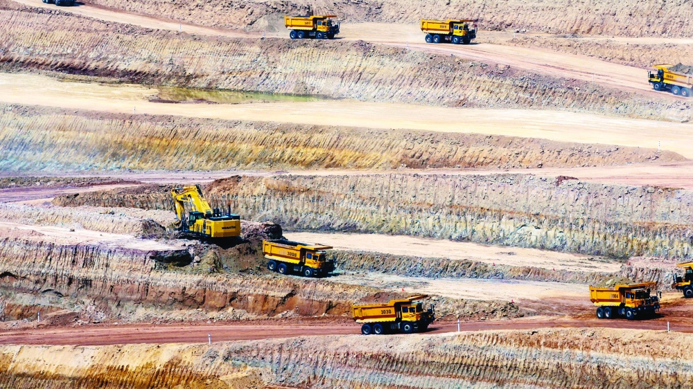 Dump trucks work in an open-pit coal mining site in Tharparkar, Pakistan. — Reuters 