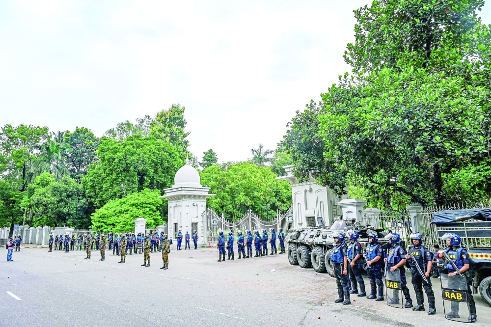 Bangladeshi soldiers and Rapid Action Battalion stand guard at the Supreme Court of Bangladesh, in Dhaka. — AFP 