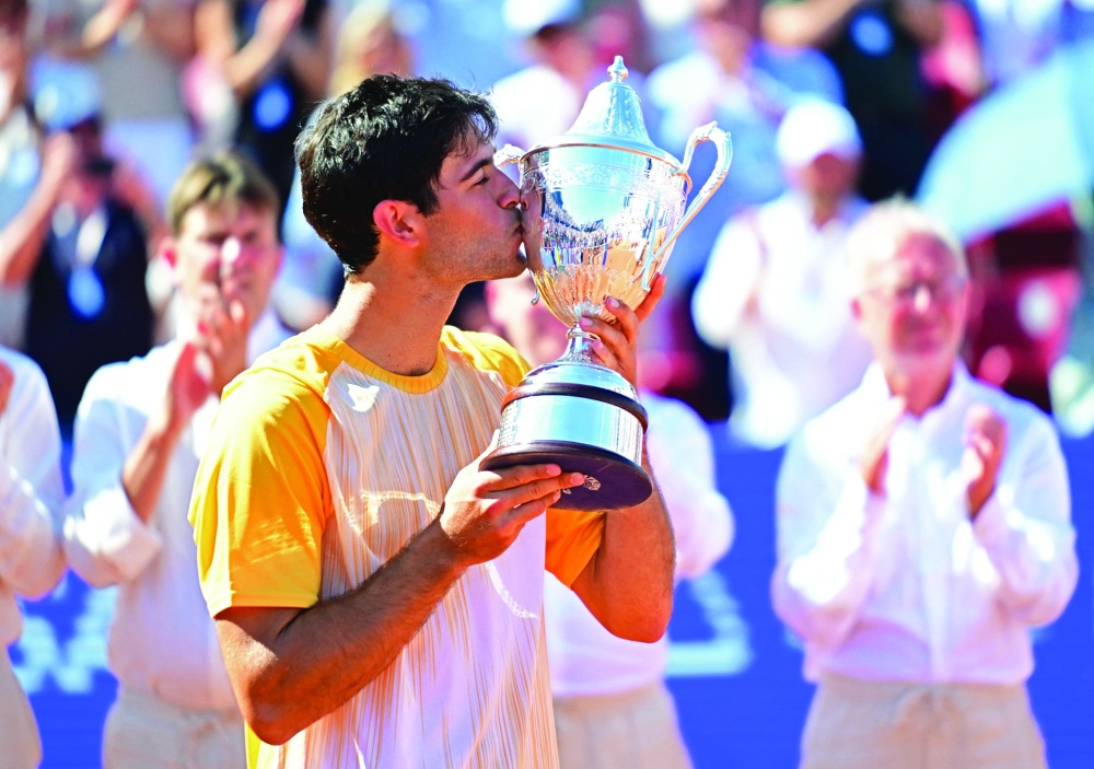 Portugal's Nuno Borges kisses the trophy. — Reuters