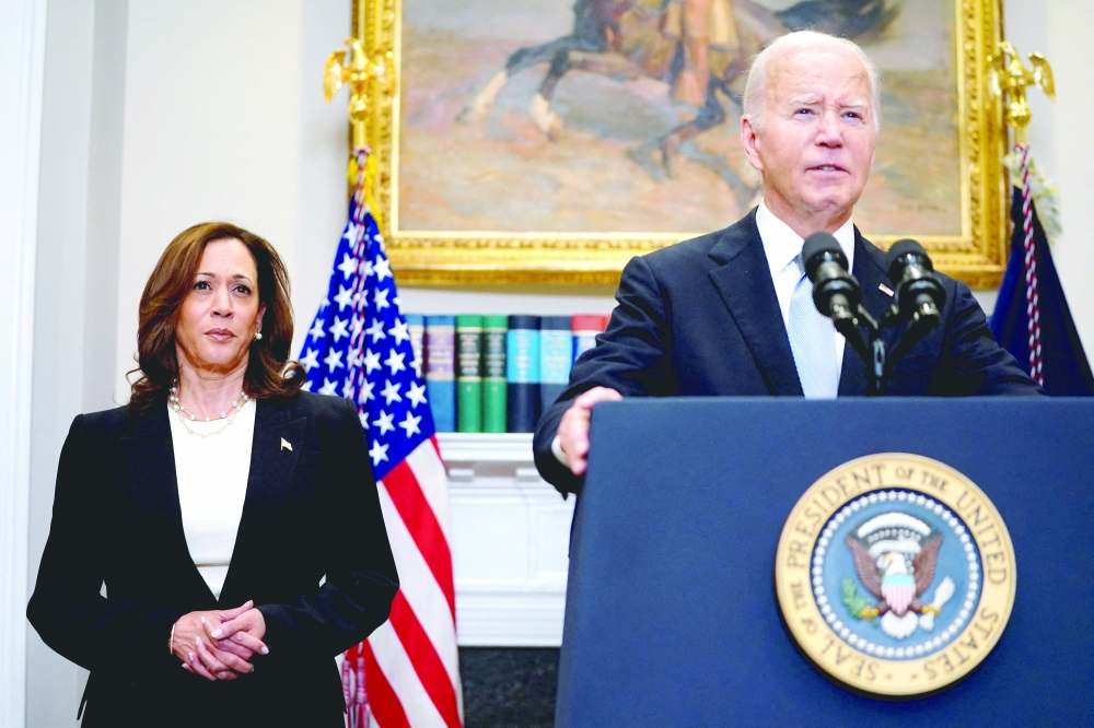 U.S. President Joe Biden speaks next to Vice President Kamala Harris, during brief remarks at the White House in Washington. — Reuters file photo