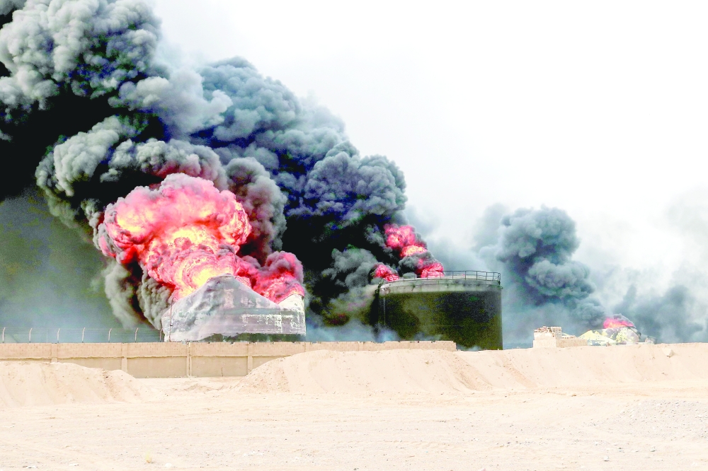 Thick smoke billows from a raging fire at oil storage tanks after Israeli strikes on the port of Hodeida, Yemen. — AFP 