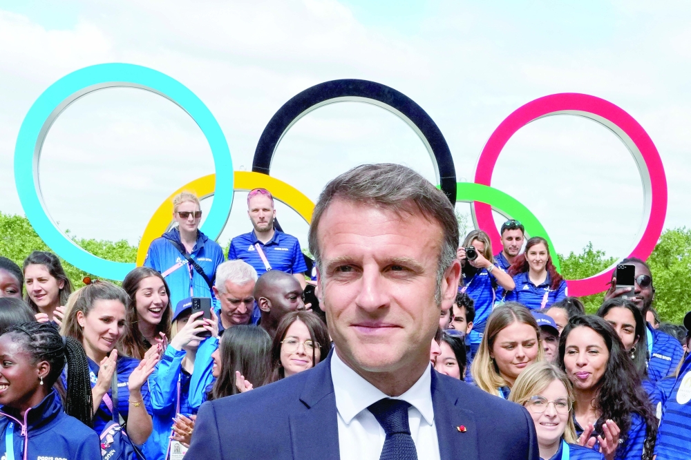 French President Emmanuel Macron meets with French athletes. — Reuters