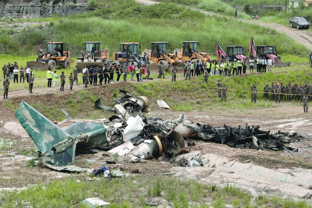 A view shows wreckage of a Saurya Airlines plane that caught fire, in Kathmandu, Nepal. — Reuters 