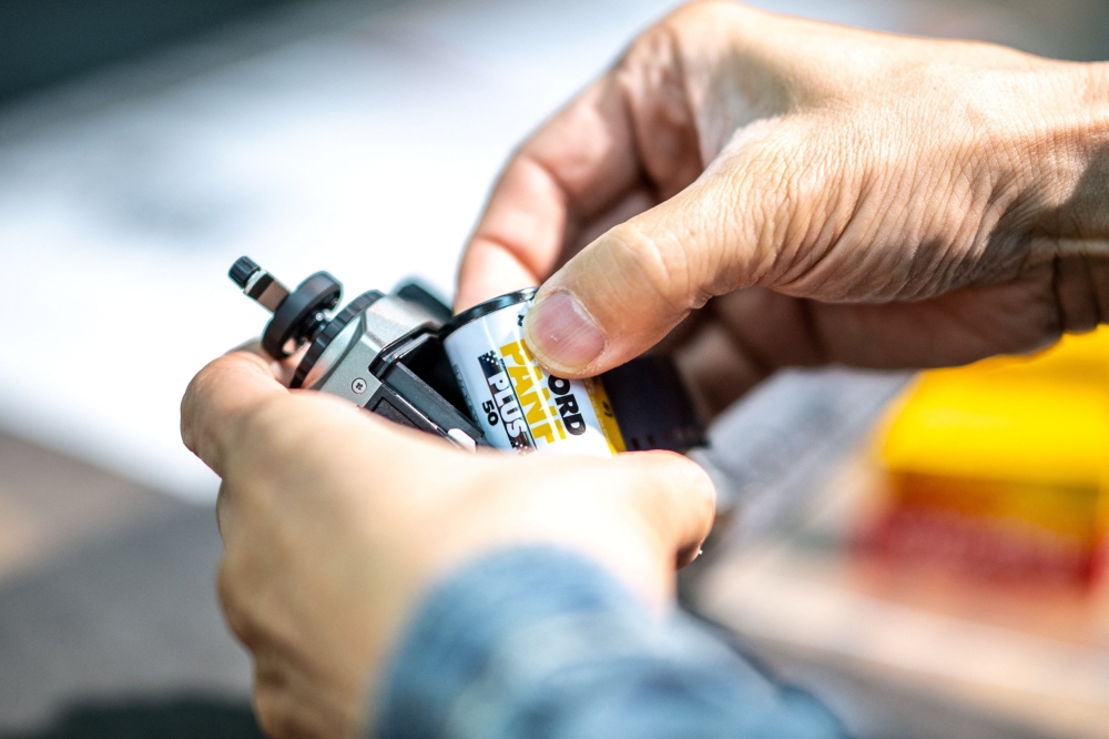 A roll of film is loaded into the newly-released Pentax 17 half-frame. — AFP 