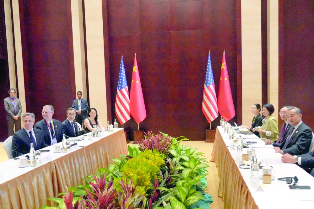 US Secretary of State Antony Blinken (L) and China's Foreign Minister Wang Yi (R) hold a meeting on the sidelines of the 57th Association of Southeast Asian Nations (ASEAN) Foreign Ministers' Meeting in Vientiane. — AFP 