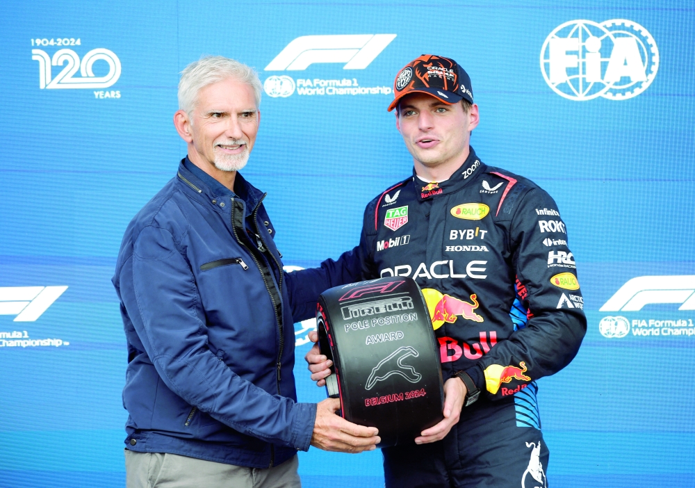 Verstappen celebrates with the trophy. — Reuters