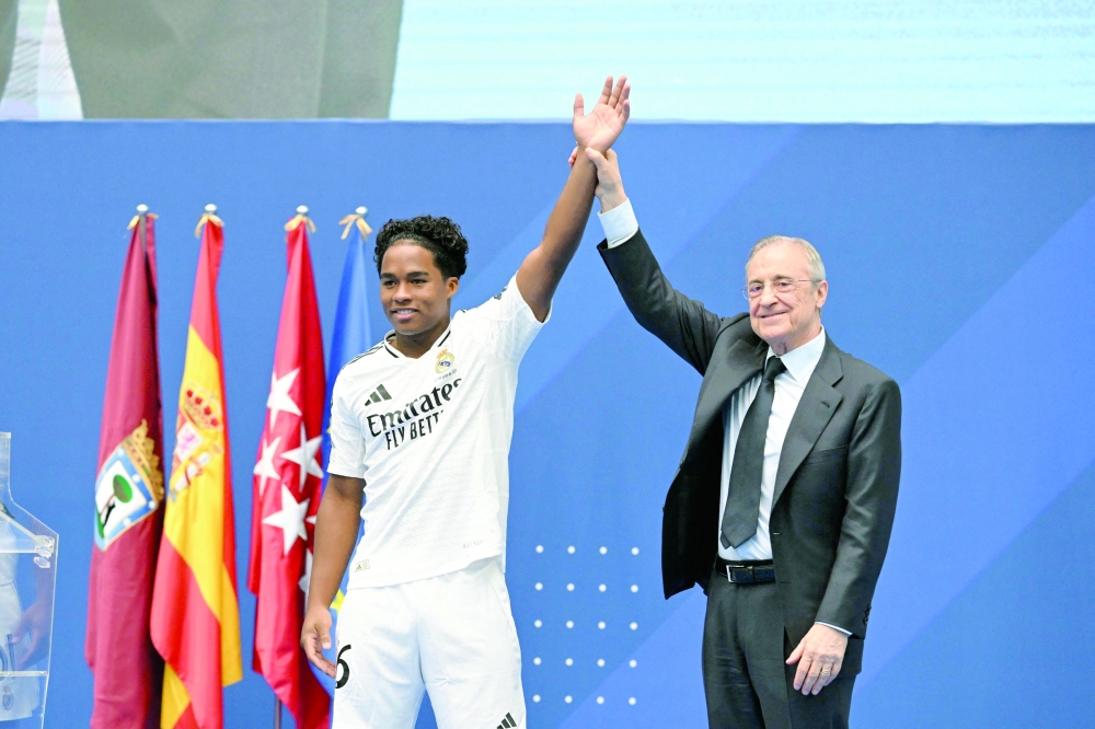 Brazilian forward Endrick Felipe (L) and Real Madrid president Florentino Perez. — AFP