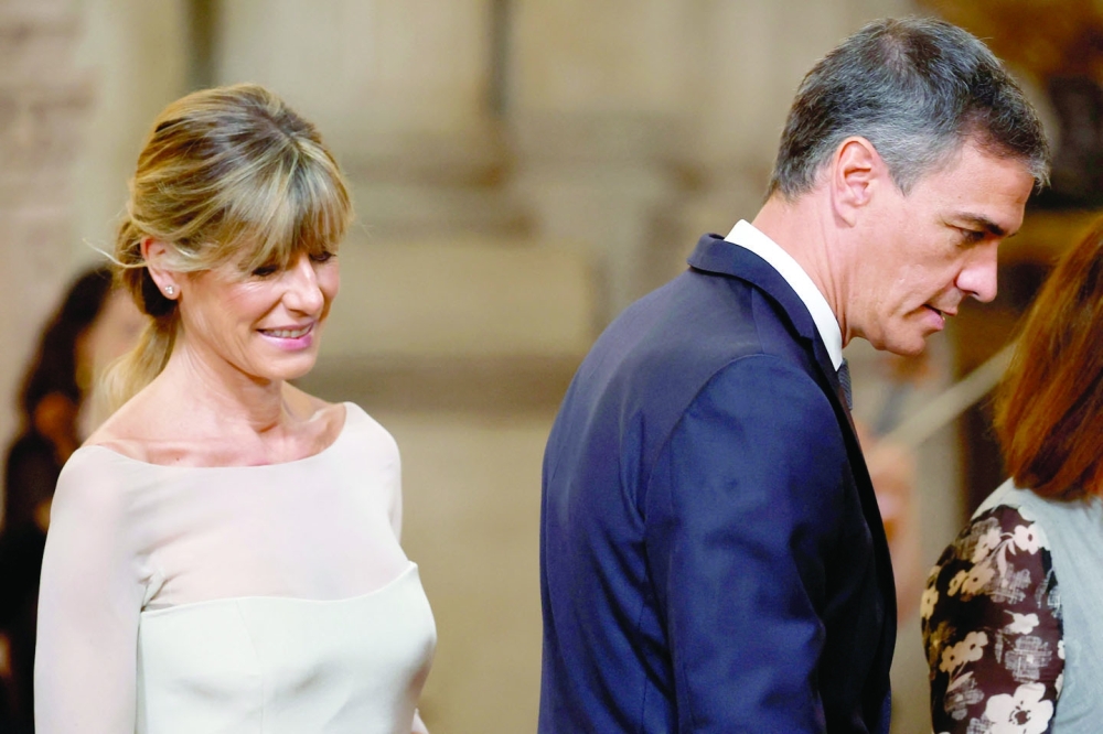 Spain's Prime Minister Pedro Sanchez (R) and his wife Begona Gomez. — AFP file photo