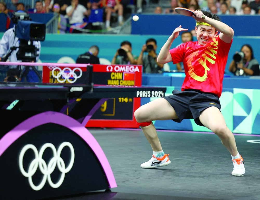 Chuqin Wang in action with Yingsha Sun. — Reuters