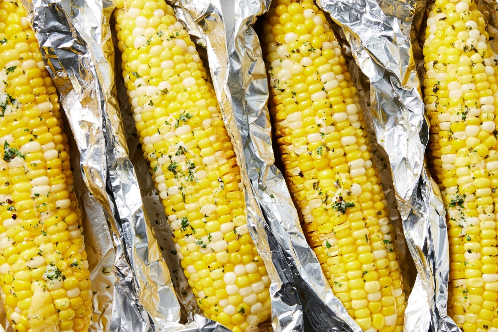 Oven-roasted corn on the cob. Food styled by Simon Andrews. (Christopher Testani/The New York Times)